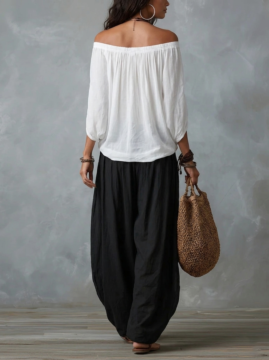 Julianna - Top bianco con spalle scoperte e pantaloni larghi a lanterna