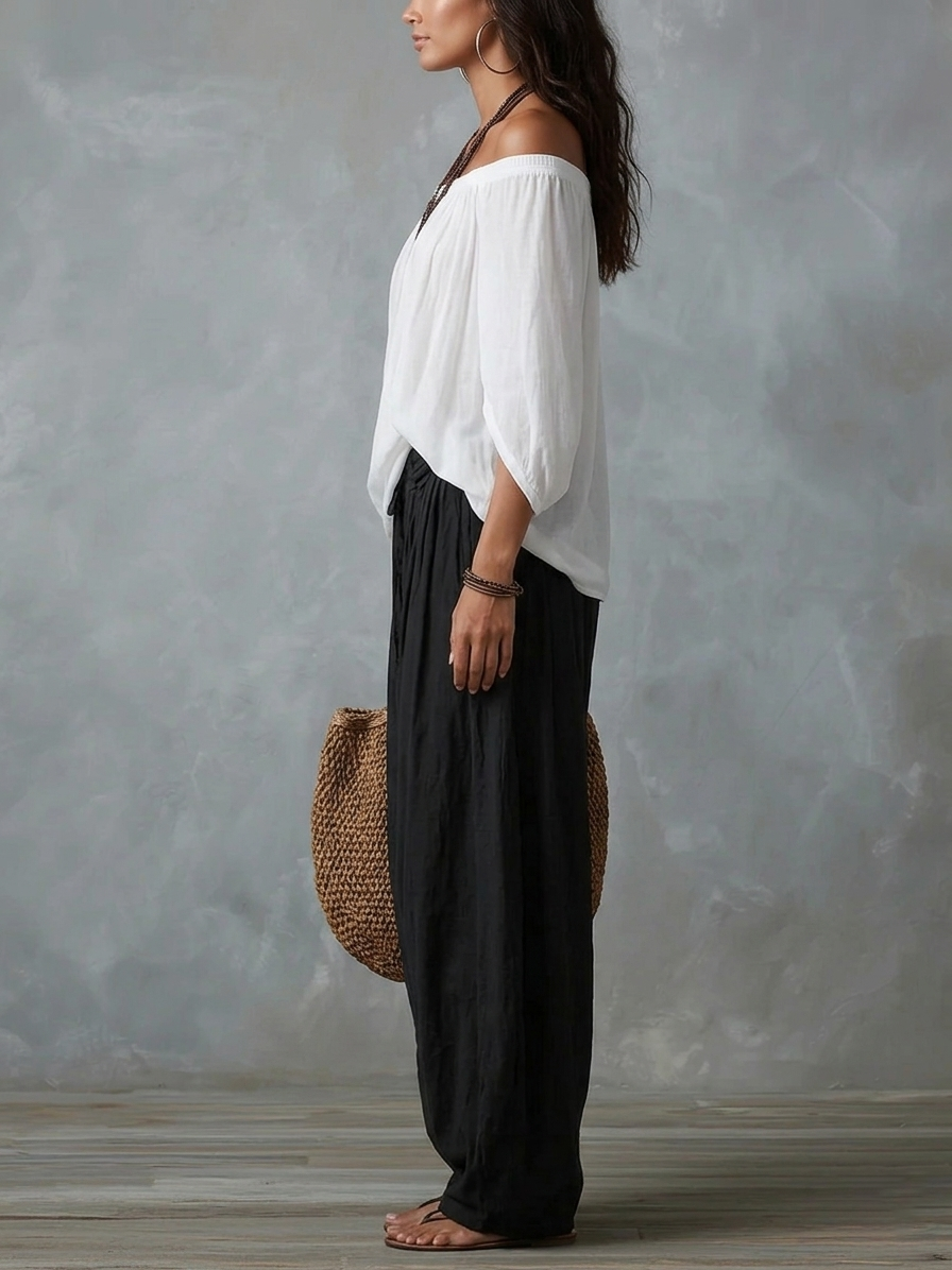 Julianna - Top bianco con spalle scoperte e pantaloni larghi a lanterna