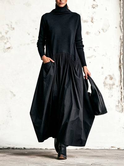 Celinne- Abito lungo oversize nero con collo alto e tasche decorative
